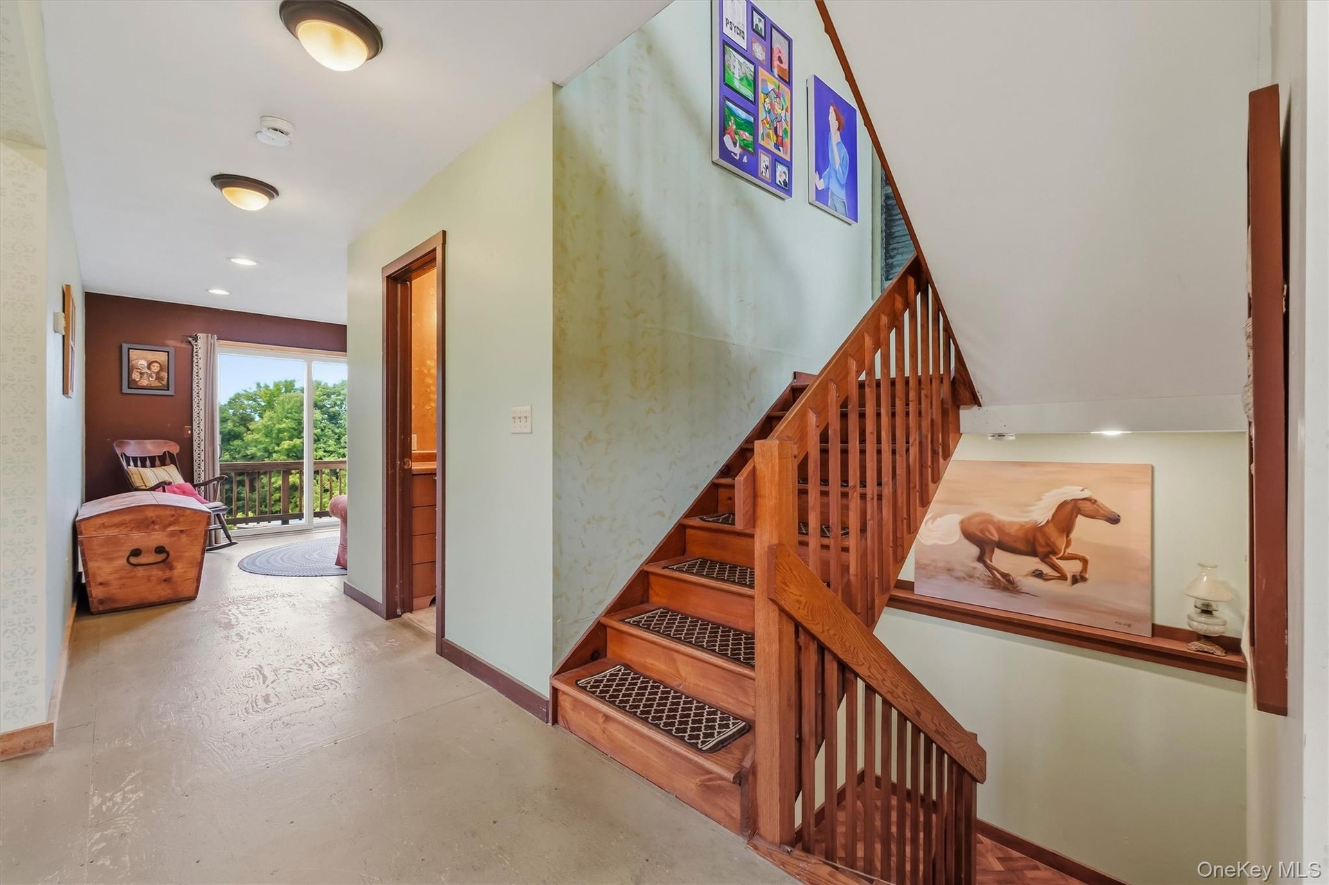 Staircase connecting the lower level to main level and upper level.