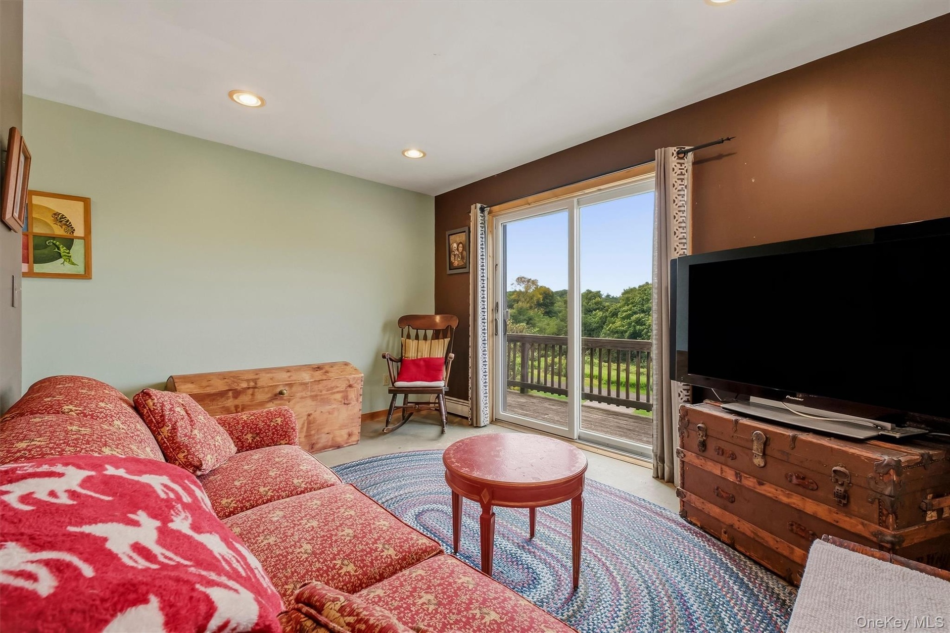 Den w/ access to the outside balcony.