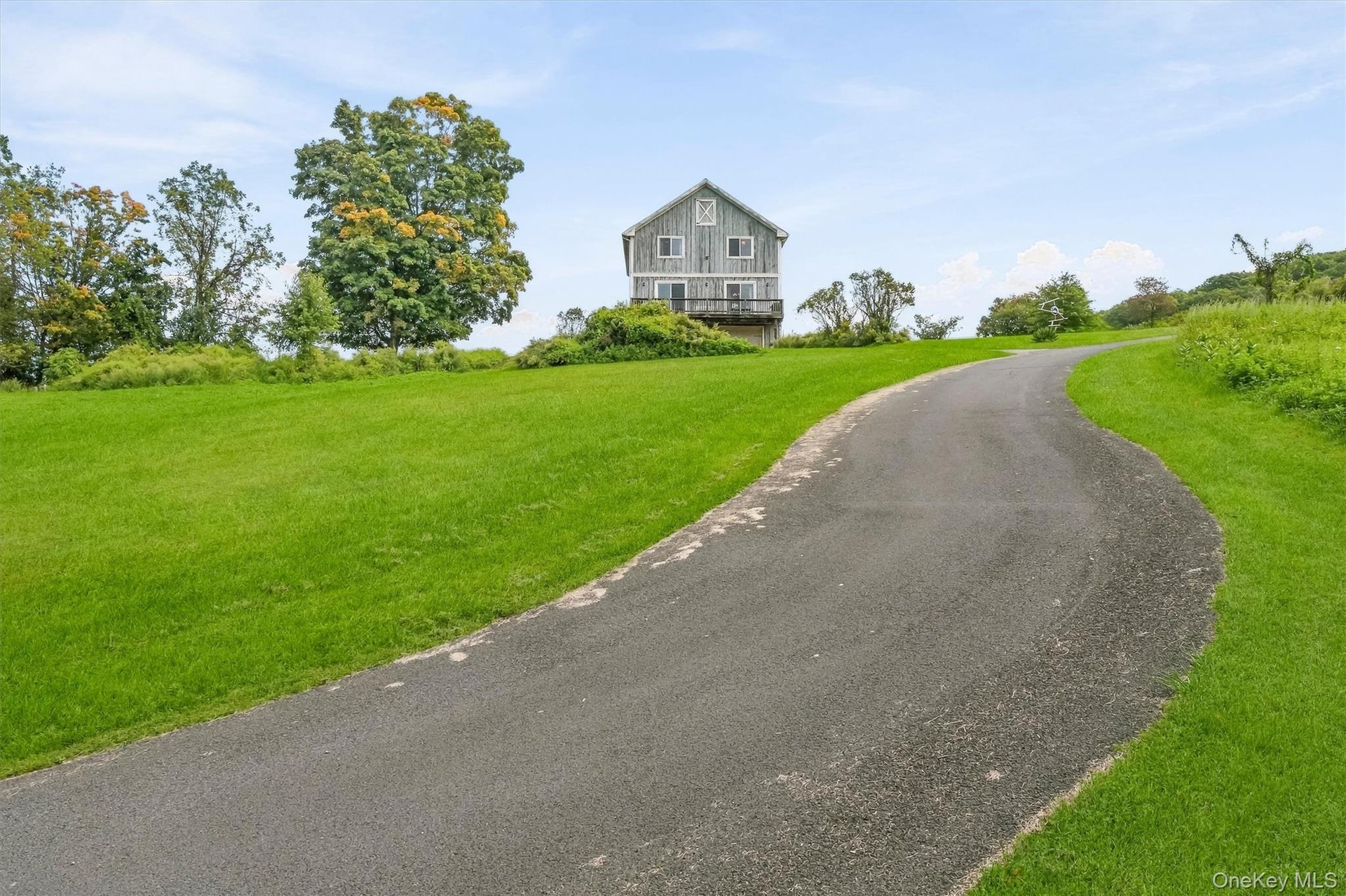 Set high on 3.43 acres backing up to the Crossroads Equestrian Center.