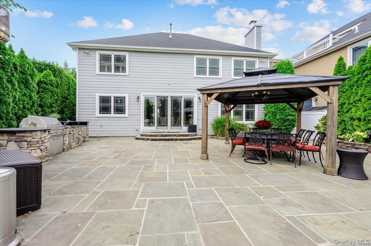 Rear Large Patio w/ Outdoor Kitchen & Pavilion
