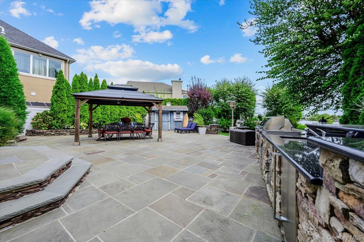 Rear Large Patio w/ Outdoor Kitchen & Pavilion