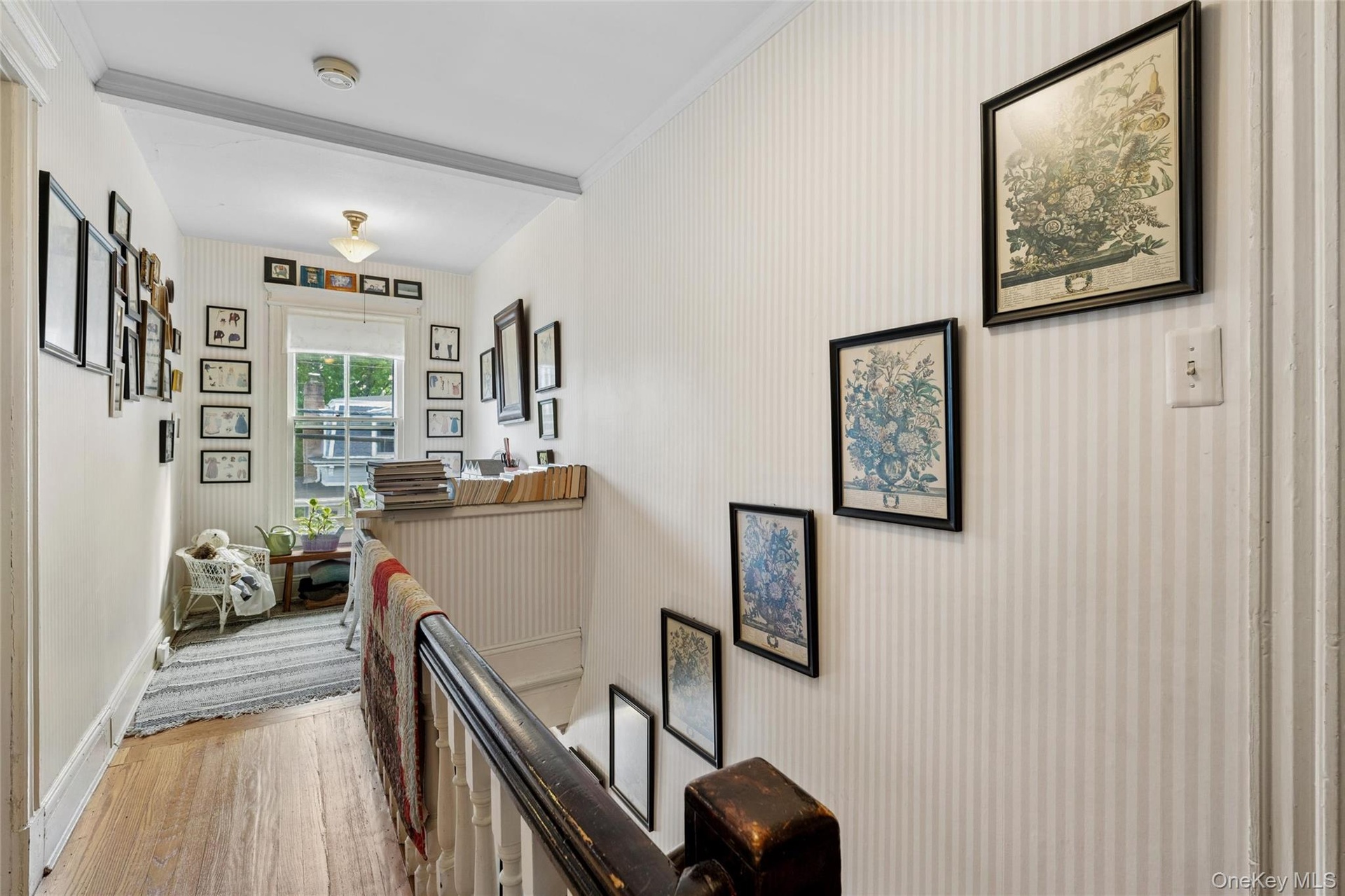 Upstairs, a sweet sunlit nook creates a natural spot for a desk, homework station, reading area, or quiet home office.