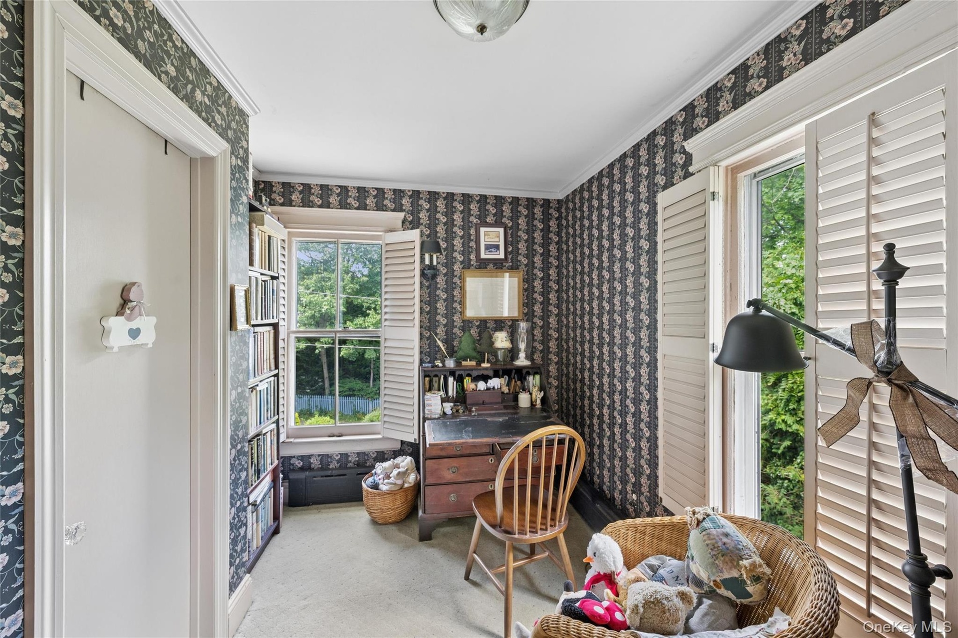 Primary bedroom office nook with entrance to bathroom