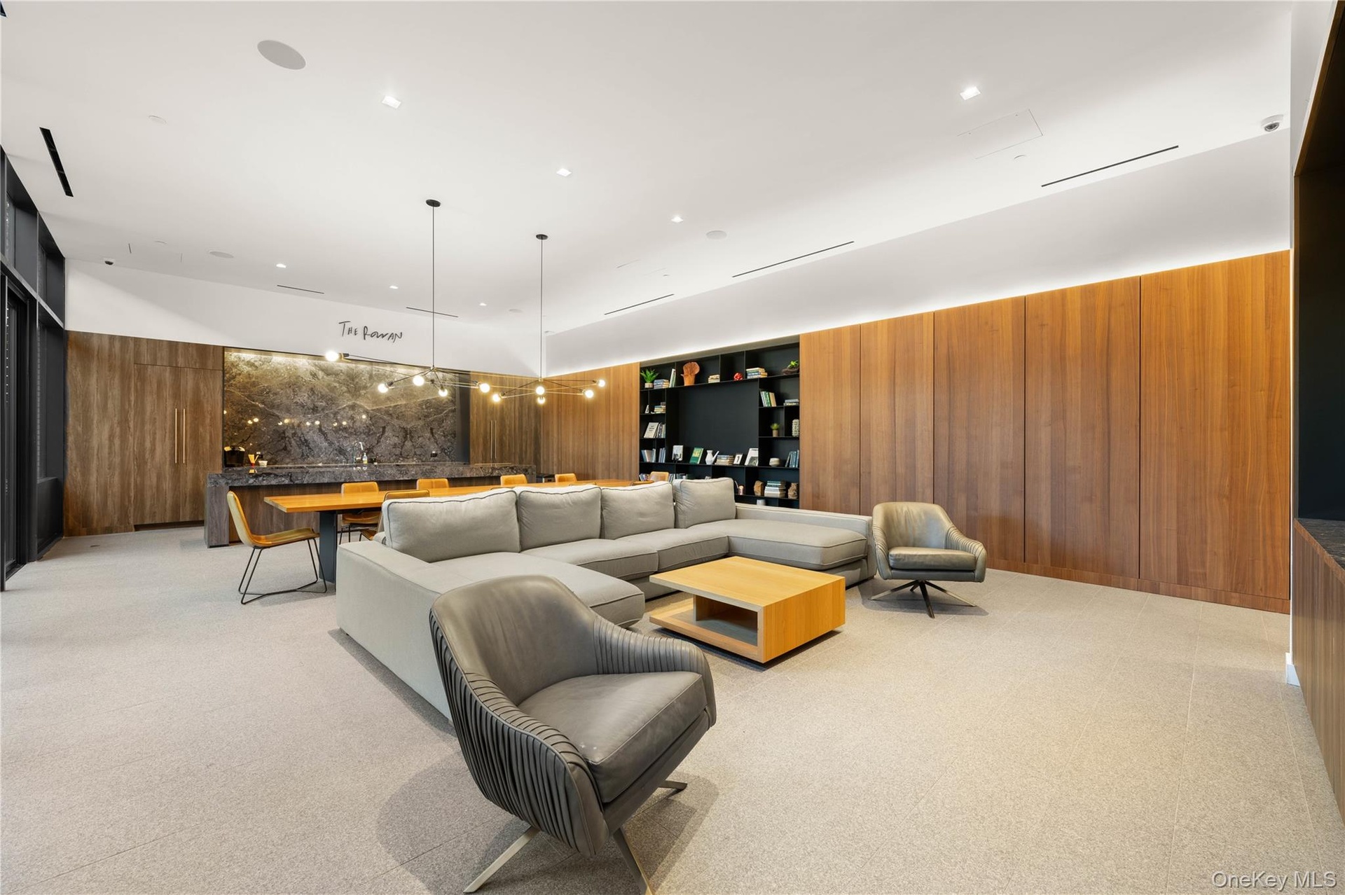 Living room featuring wood walls, light carpet, and recessed lighting