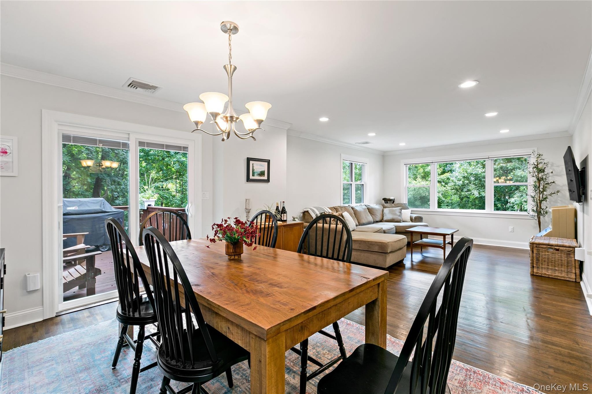 Dining Room with open layout to living room and sliding glass door to deck