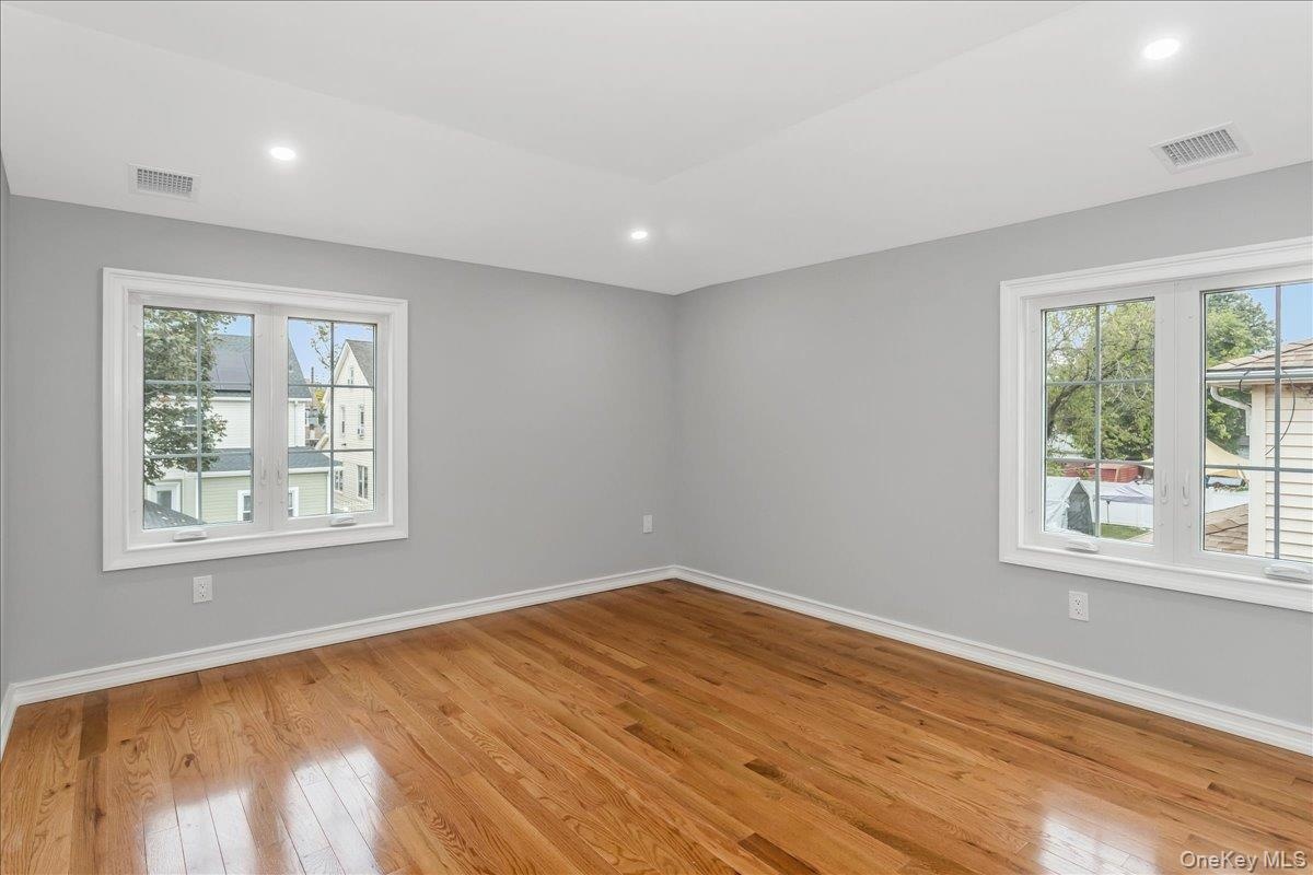 Empty room featuring recessed lighting and light wood finished floors