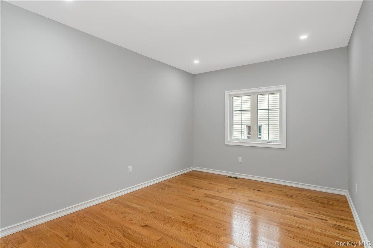 Spare room with light wood-style flooring and recessed lighting