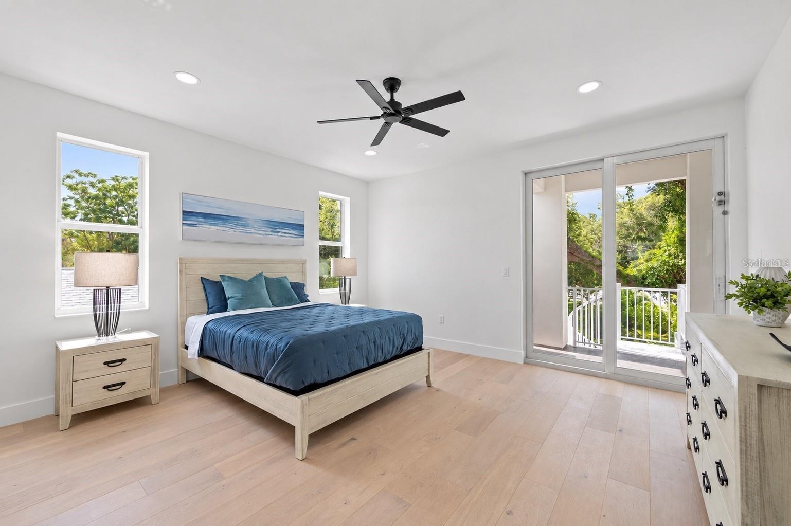 Guest bedroom, with access to the balcony that has the spiral staircase to the pool deck