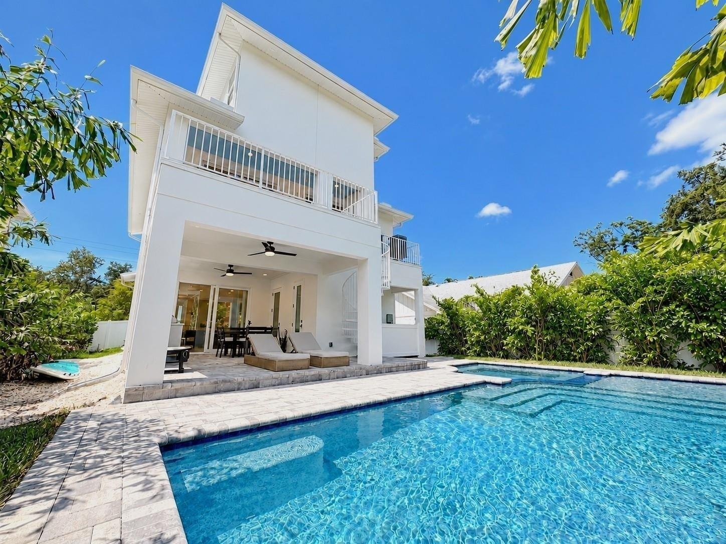 Heated saltwater pool, with a covered patio and outdoor kitchen