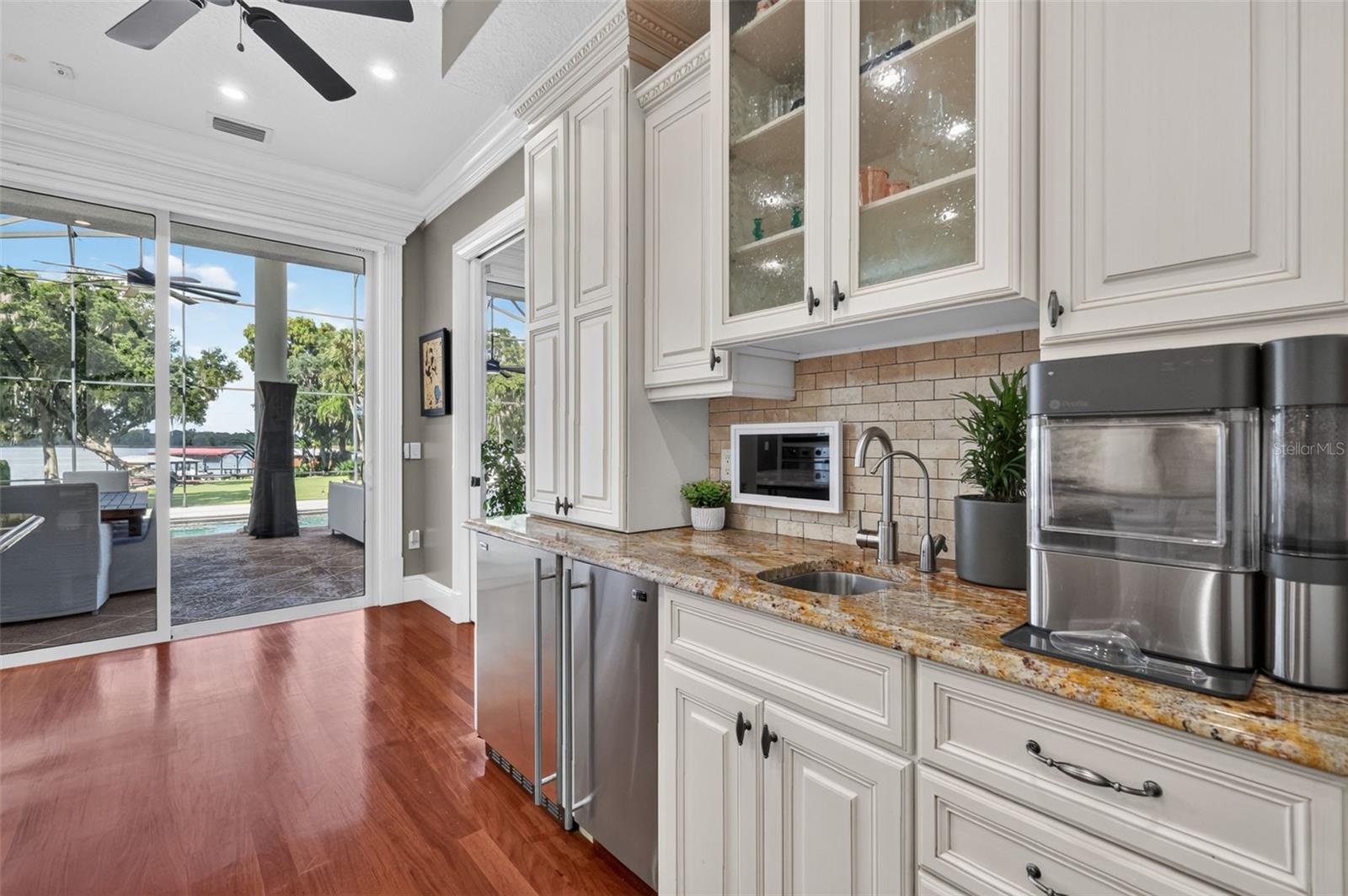 Kitchen with stunning views of the pool and Lake Carlton