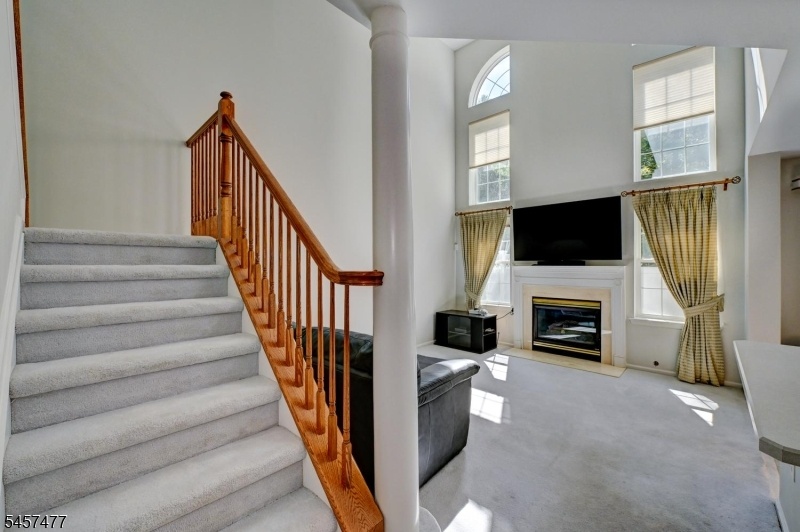 Stairs and view of den