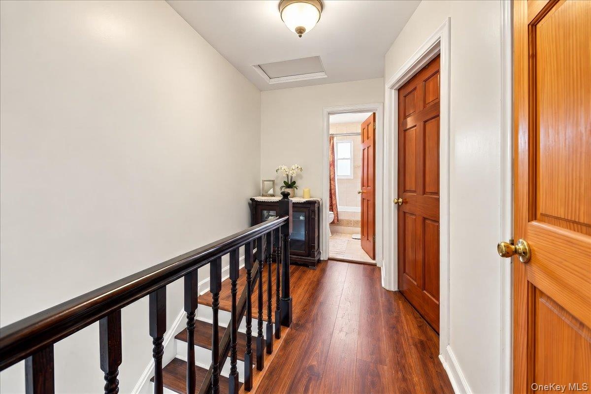Upstairs hallway connecting bedrooms and full bath