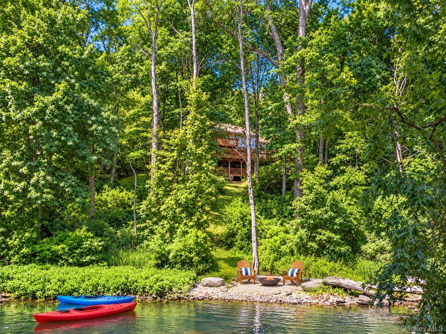 A private pathway leads directly to the the East Branch Croton River’s edge, where peaceful moments by the water or a leisurely kayak down the river a