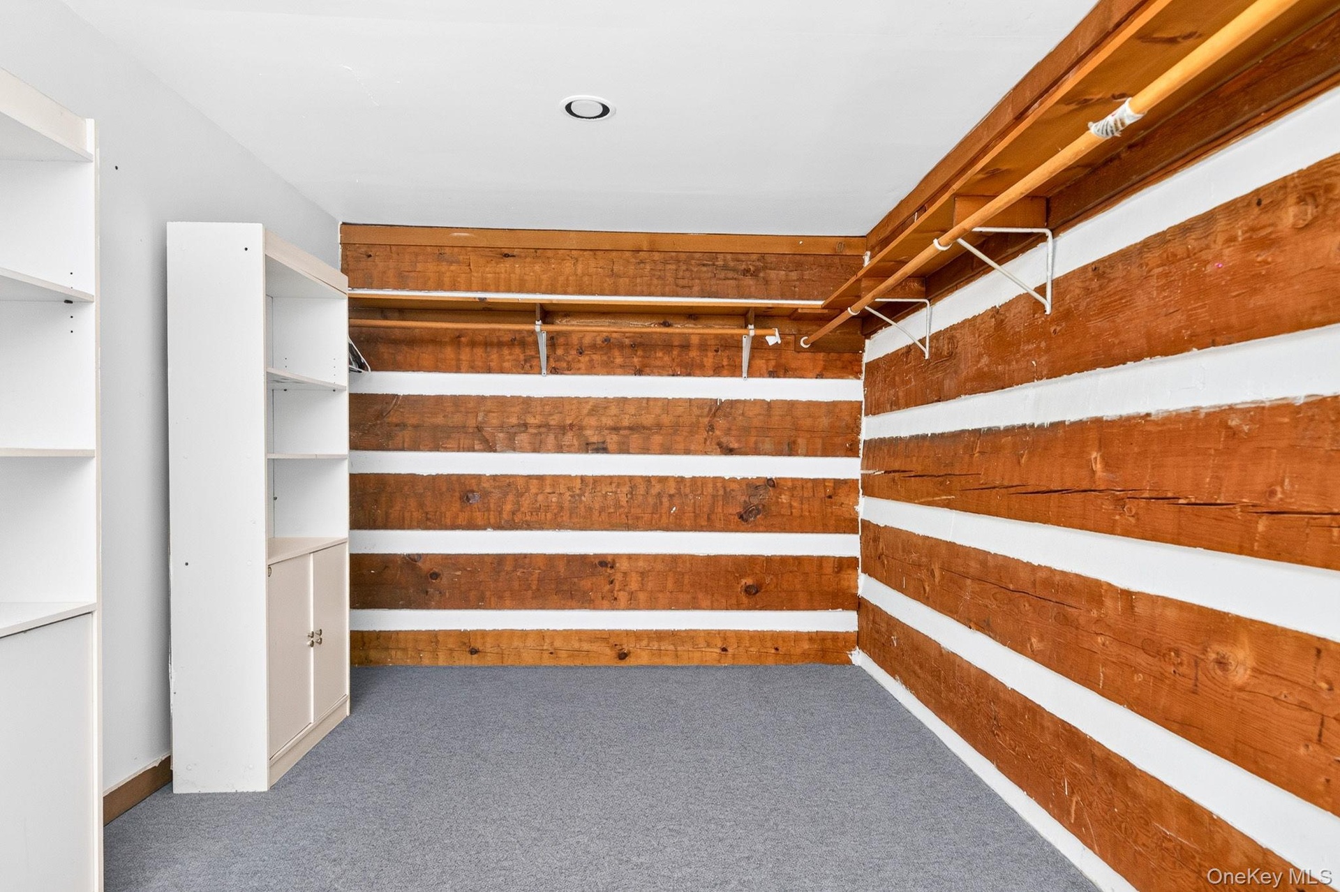 Primary bedroom walk-in closet