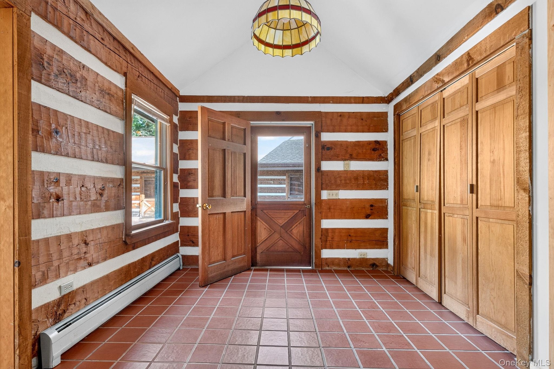 Mudroom with ample closets.