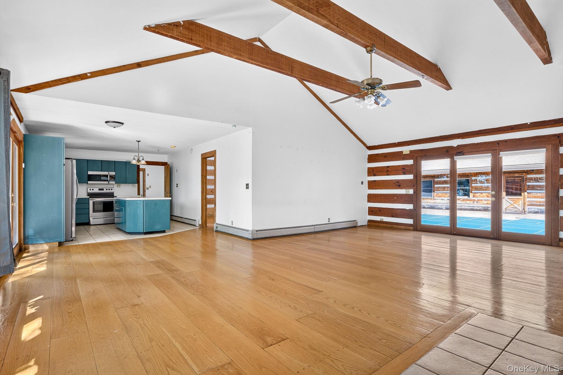 Second residence.  Family room to kitchen.  Wide plank hardwood floors.  Vaulted beamed ceiling.