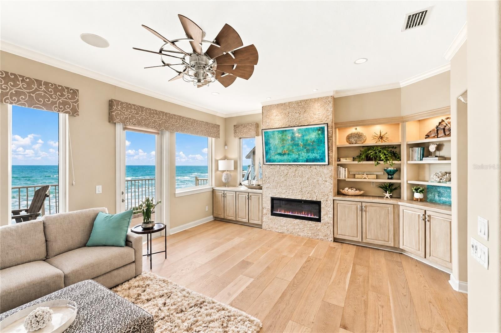 Living Area with Electric Fireplace & Built-In Shelving