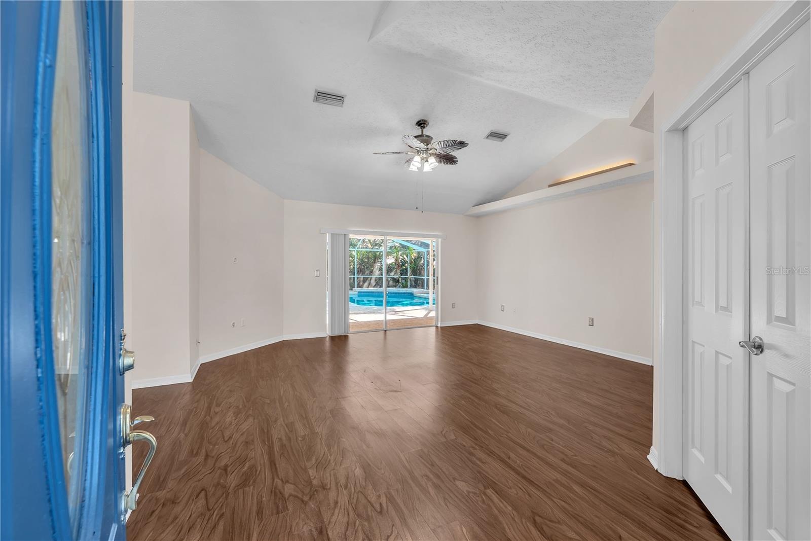 Step through the welcoming foyer and into the formal living and dining rooms with the double doors leading into a convenient office space or forth bed