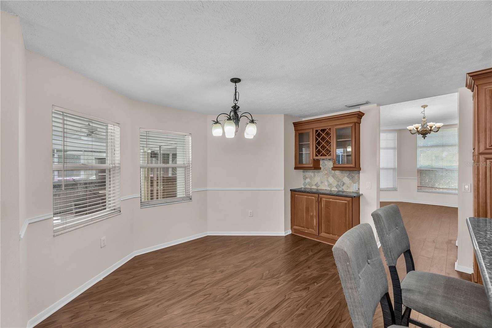 There is room for a casual dining table that overlooks the lanai and pool.