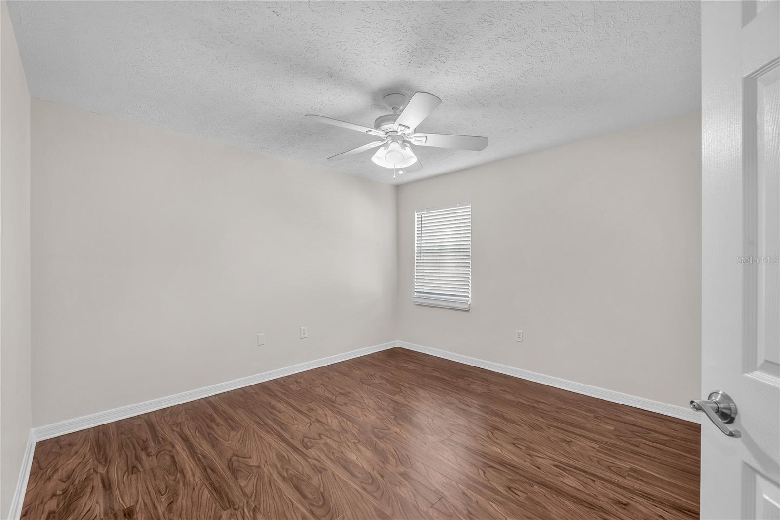 Bedroom #2 is located on the opposite side of the home from the primary bedroom.