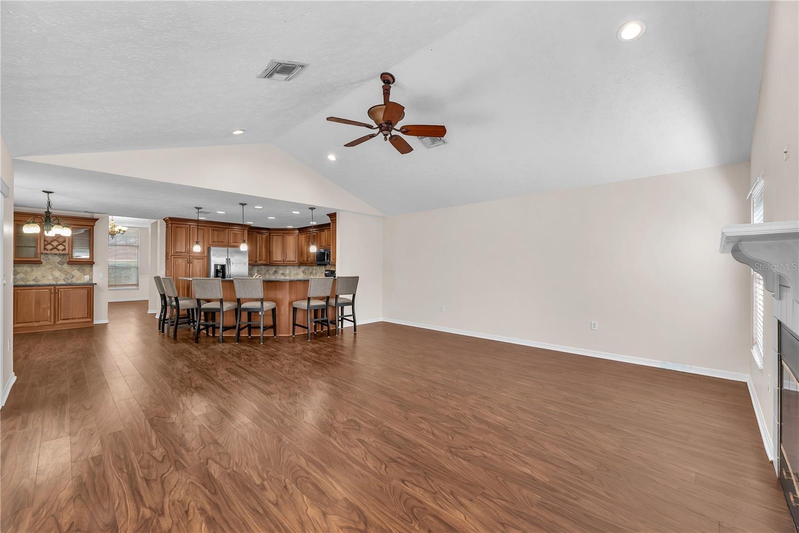 There is a seamless and easy connection between the family room and kitchen.