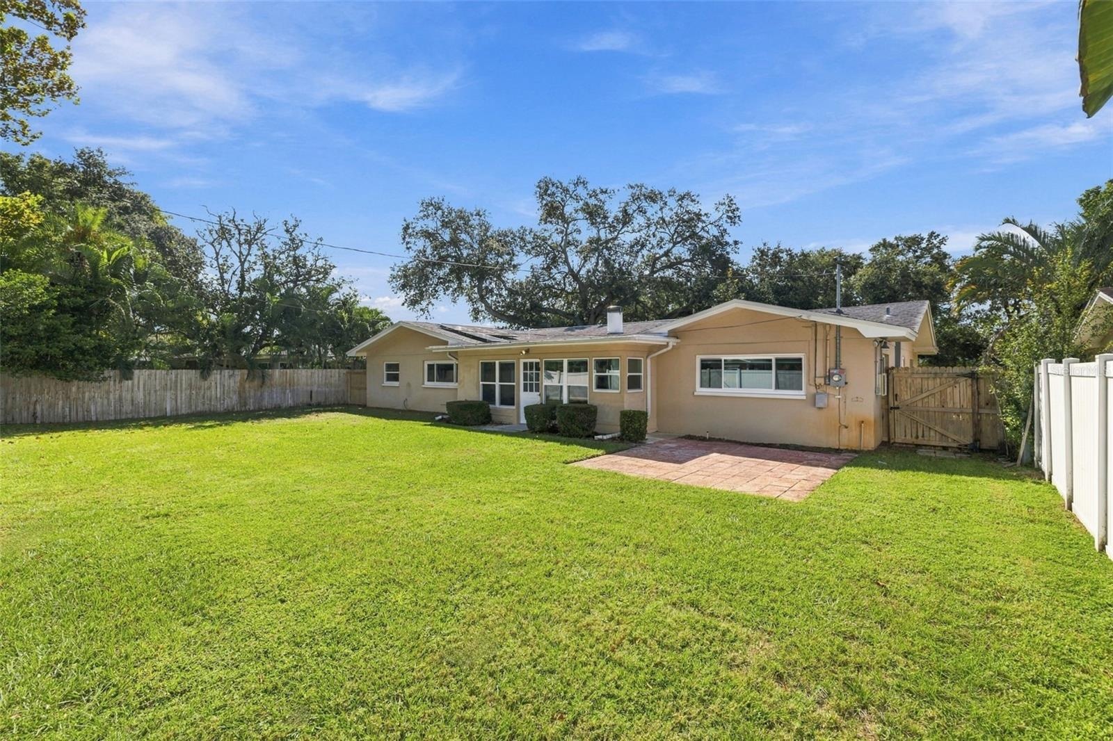 A view of the backyard and rear of the home.