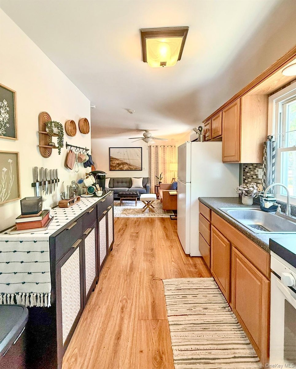 Upper Apartment  Galley Kitchen with wood flooring