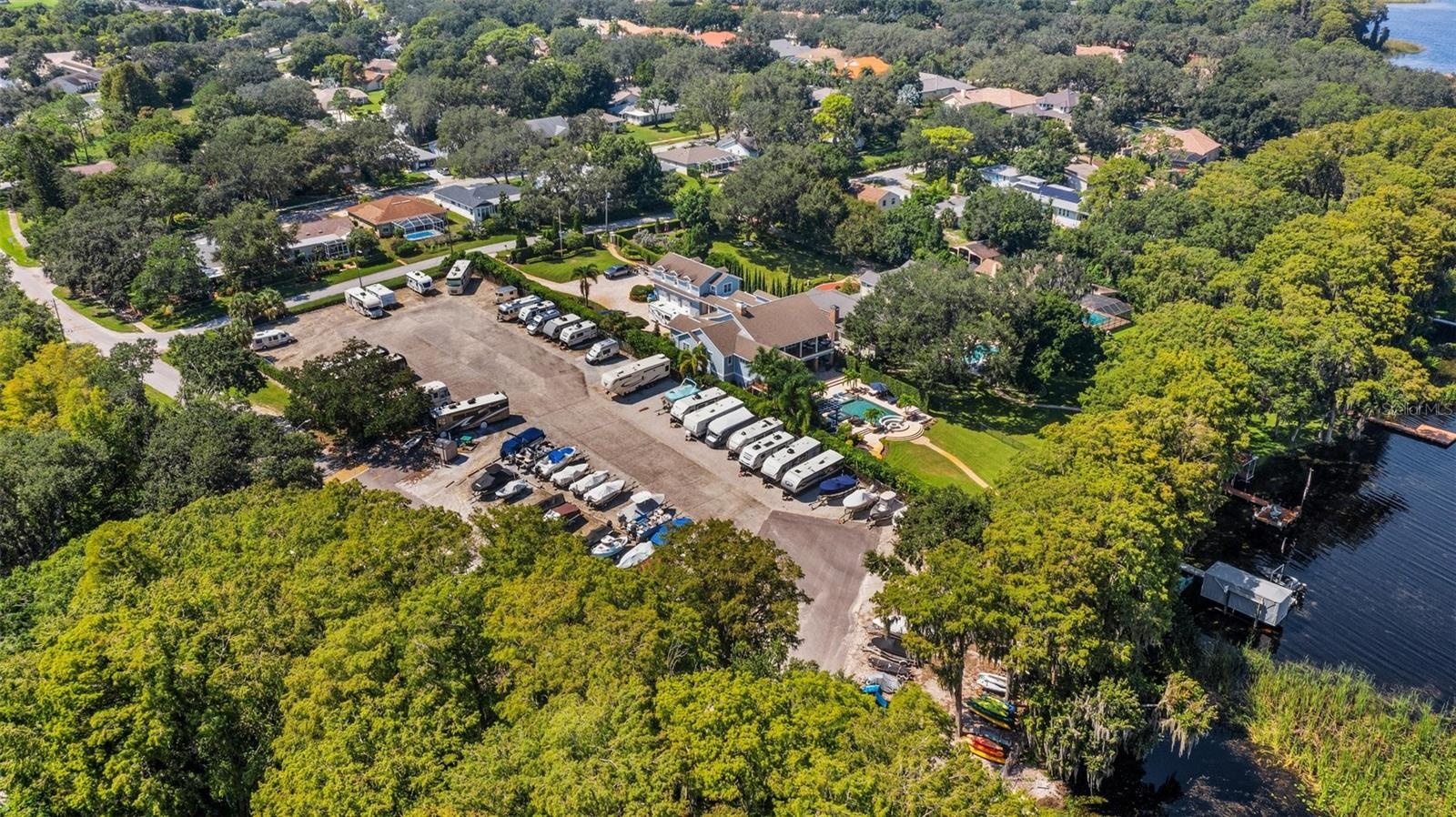 Lake Tarpon Lodge connected to RV lot & boat ramp by an open dock & fishing pier~