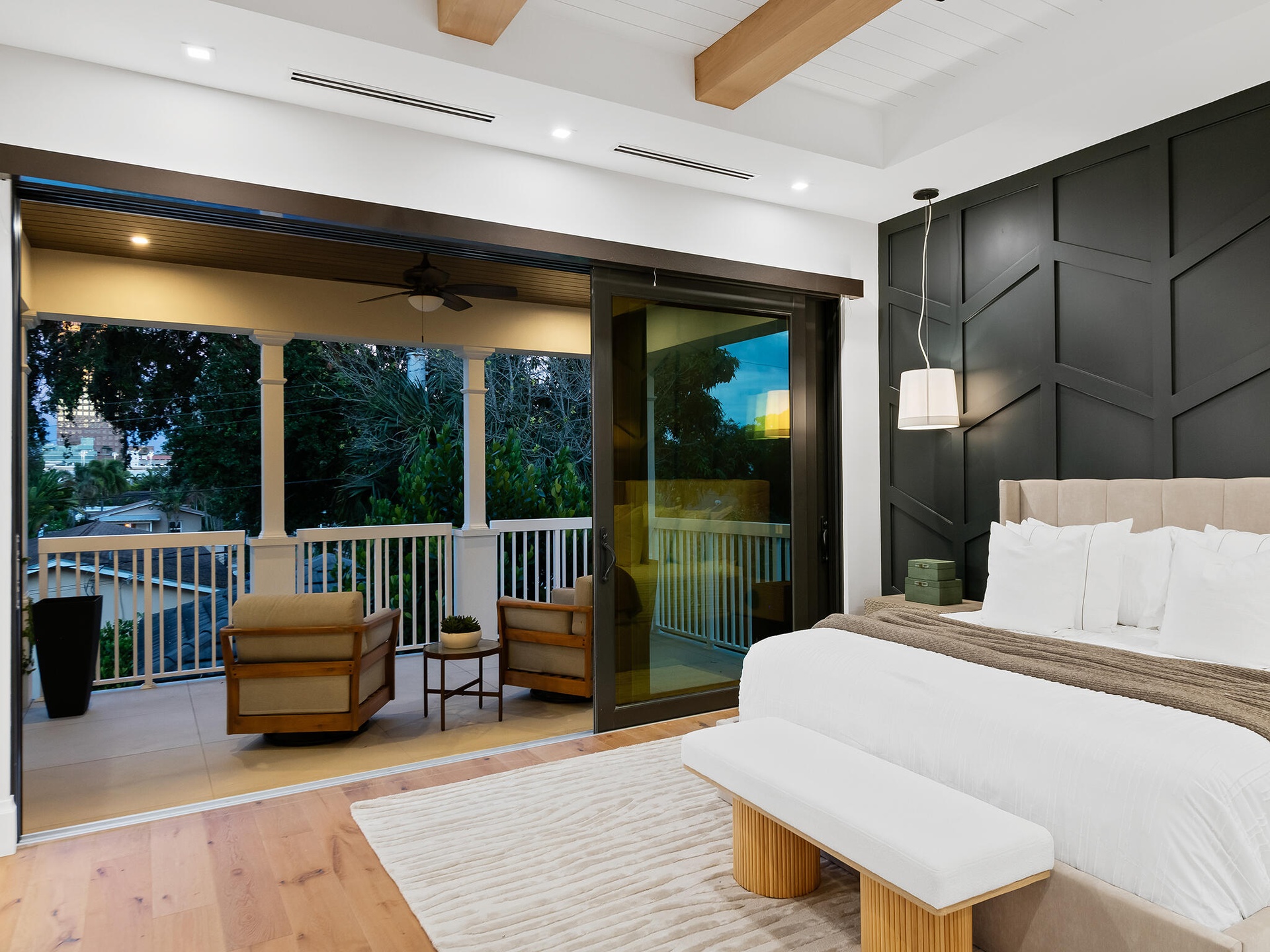 Primary suite opening to the private balcony