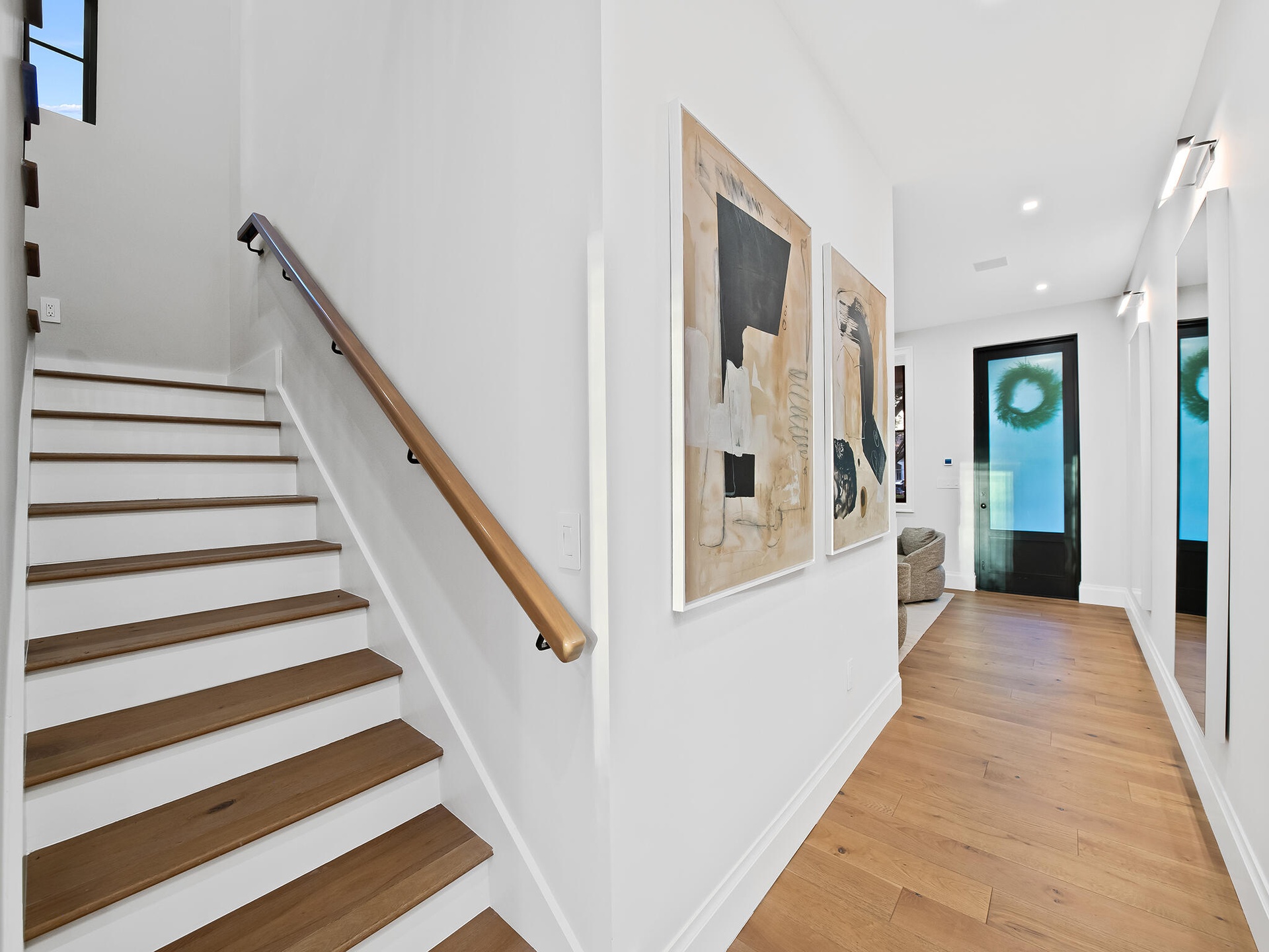 Staircase with wood handrail