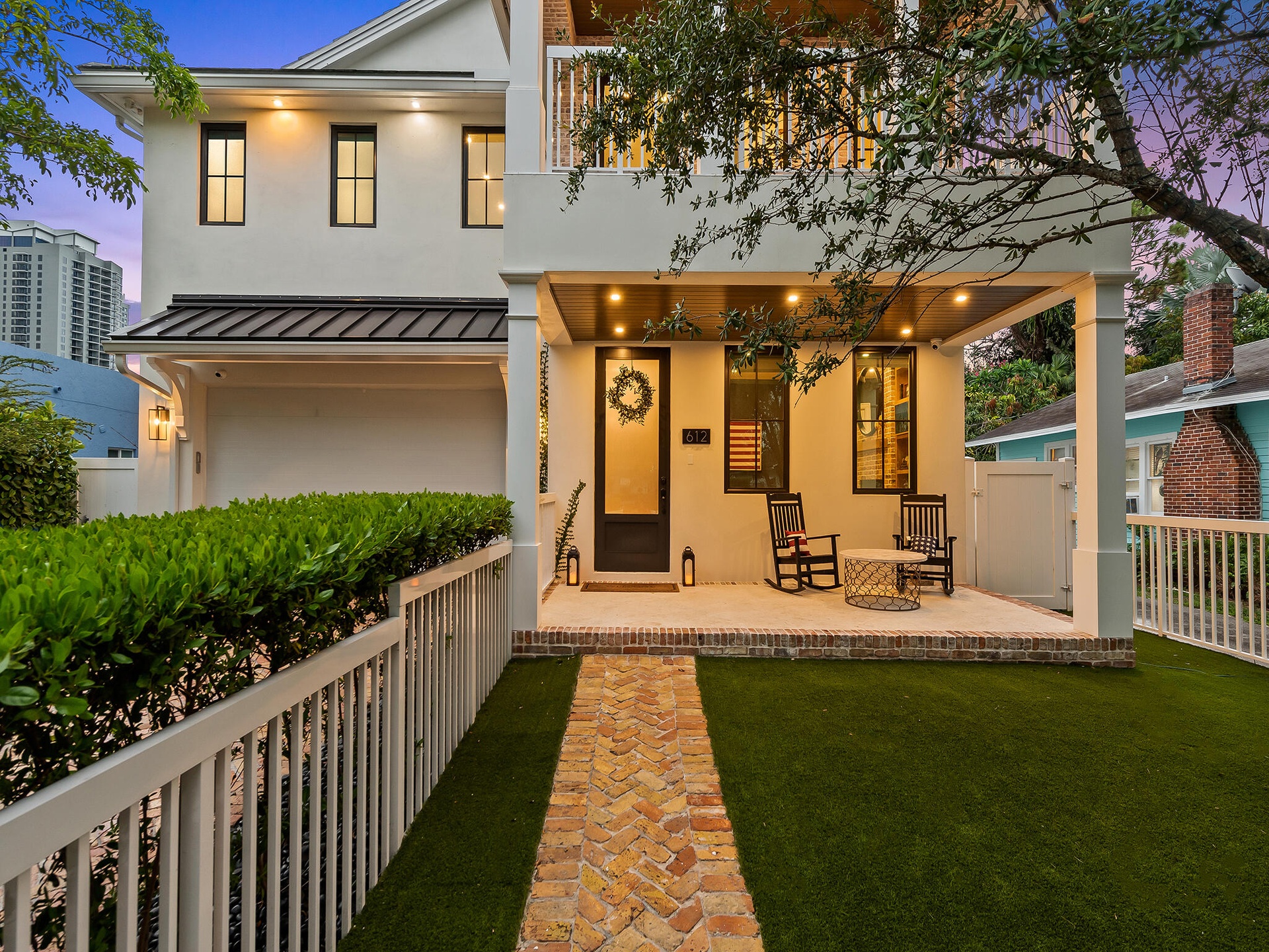 Front exterior with lawn and landscaping