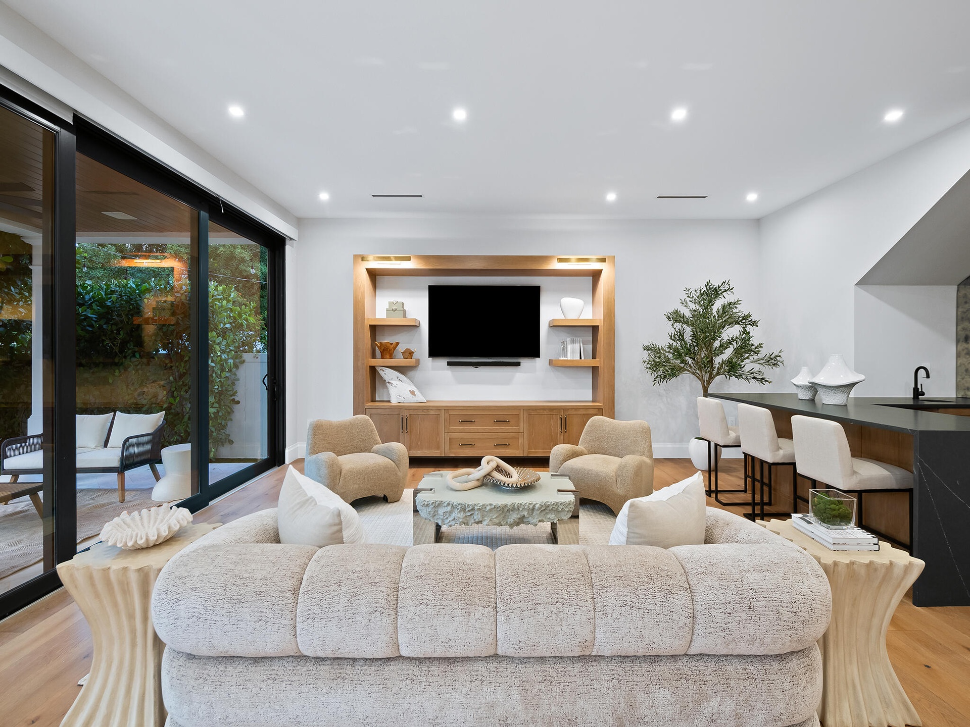 Living room with built-in media wall and fireplace