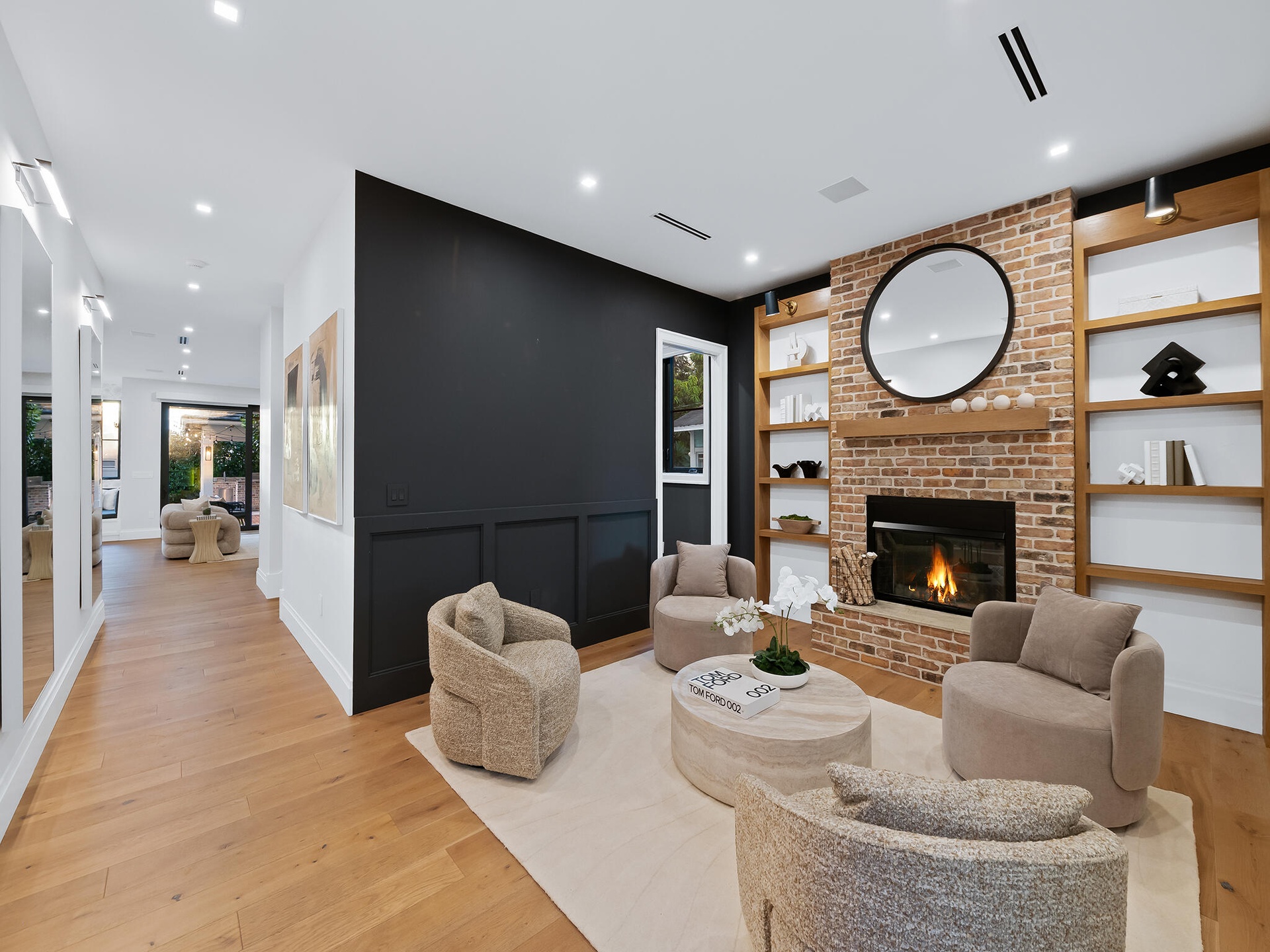 Great room with fireplace open to the entry
