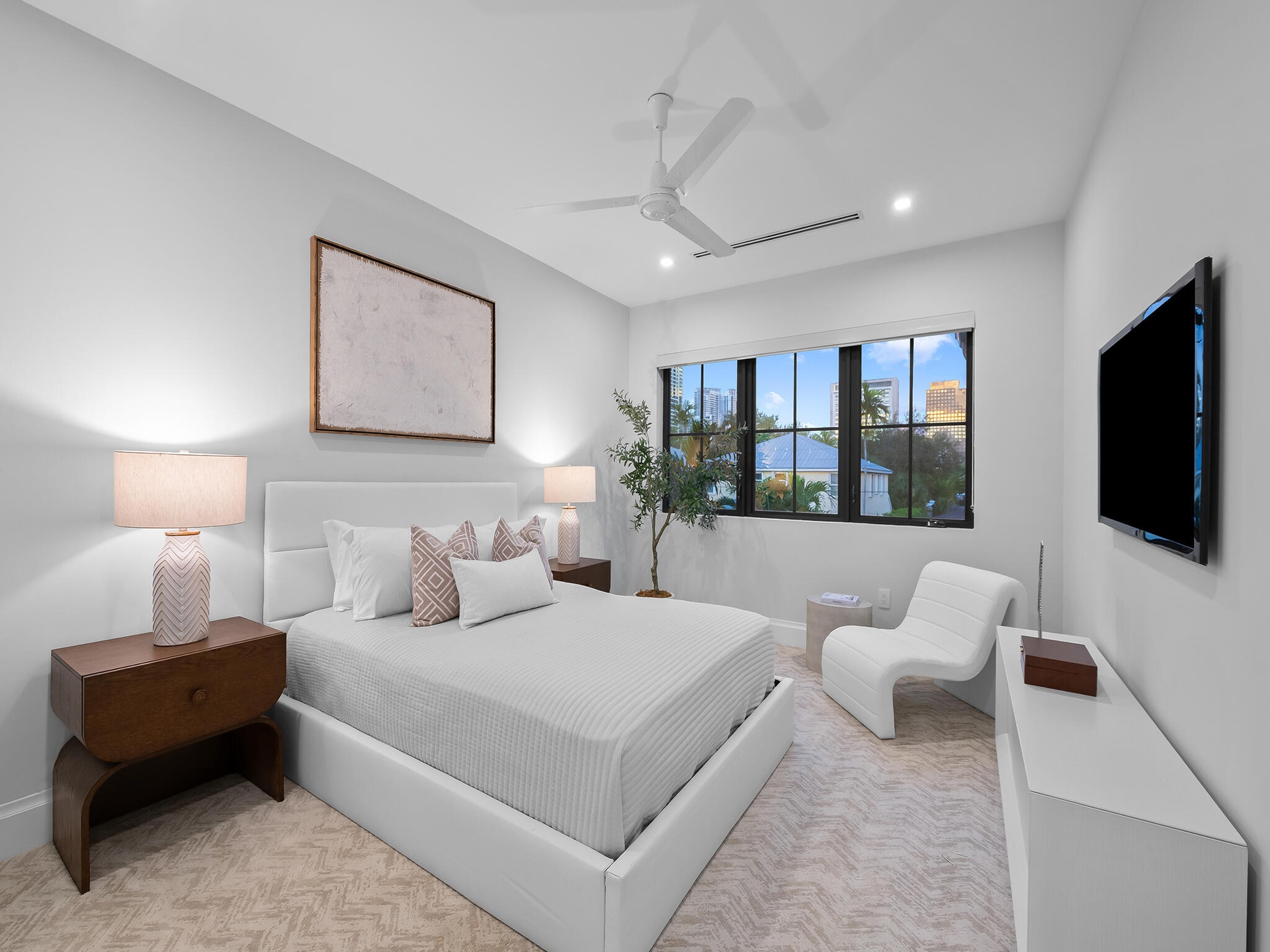 Bright guest bedroom with seating