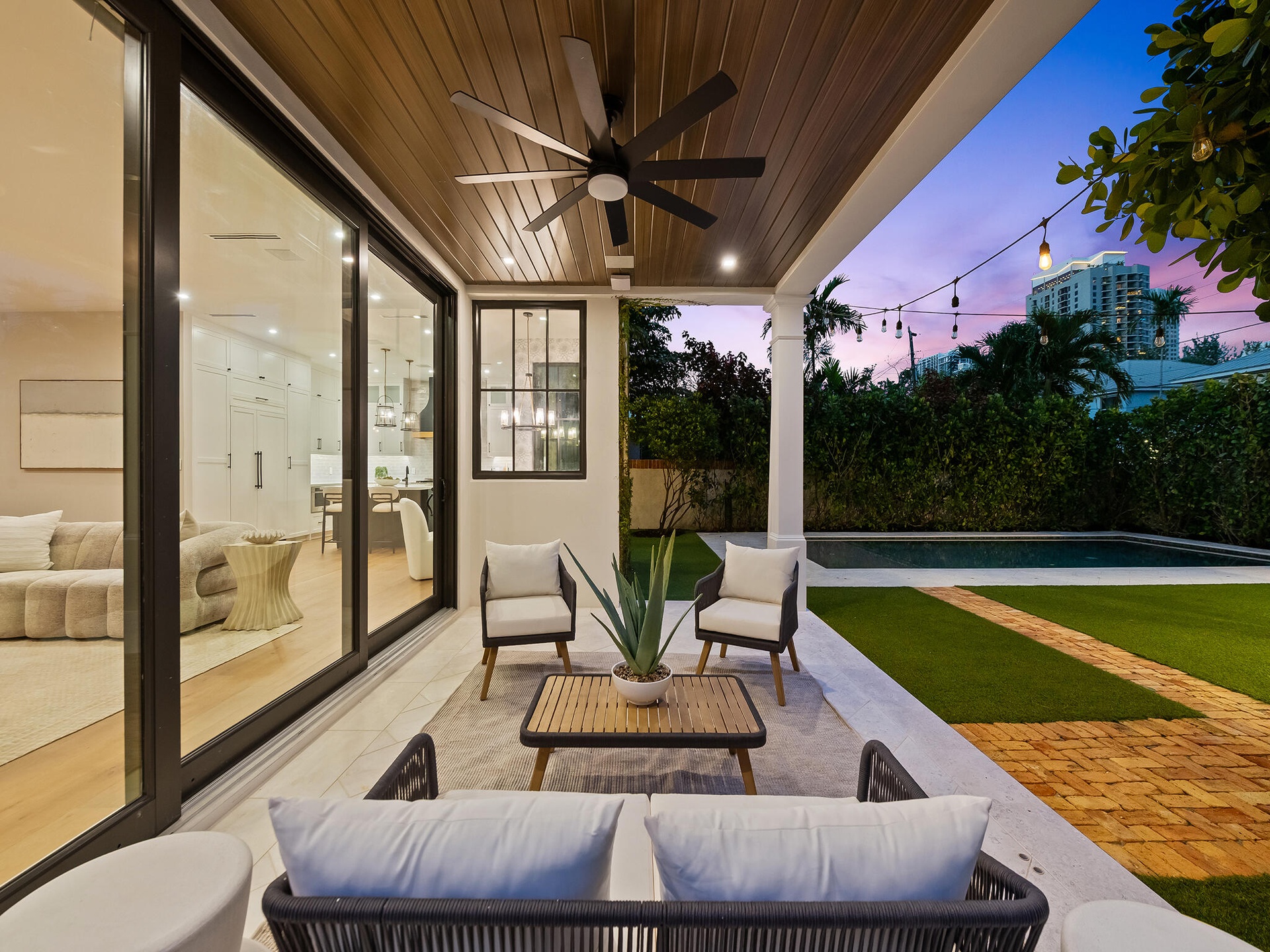 Covered patio with pool beyond