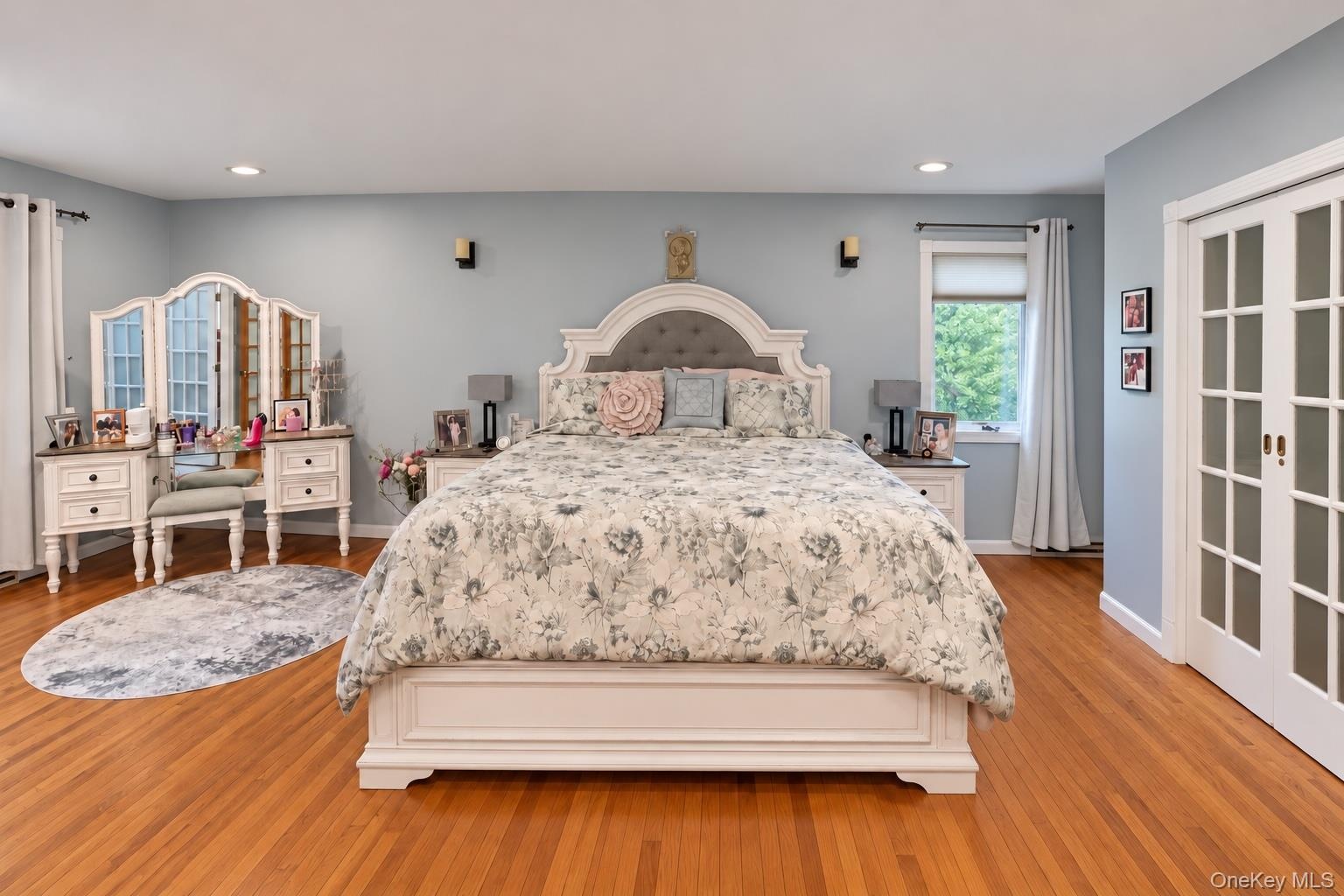 Large walk in closet behind French doors