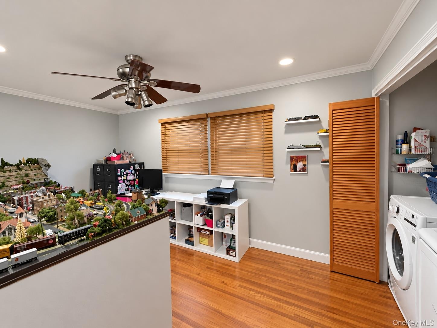 Bedroom with washer/dryer tucked away in closet