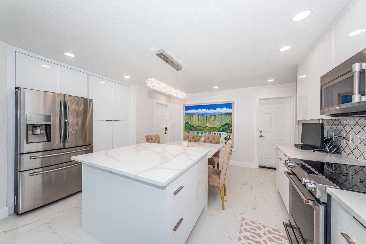 Beautiful quartz island with deep soft close drawers and charging outlets
