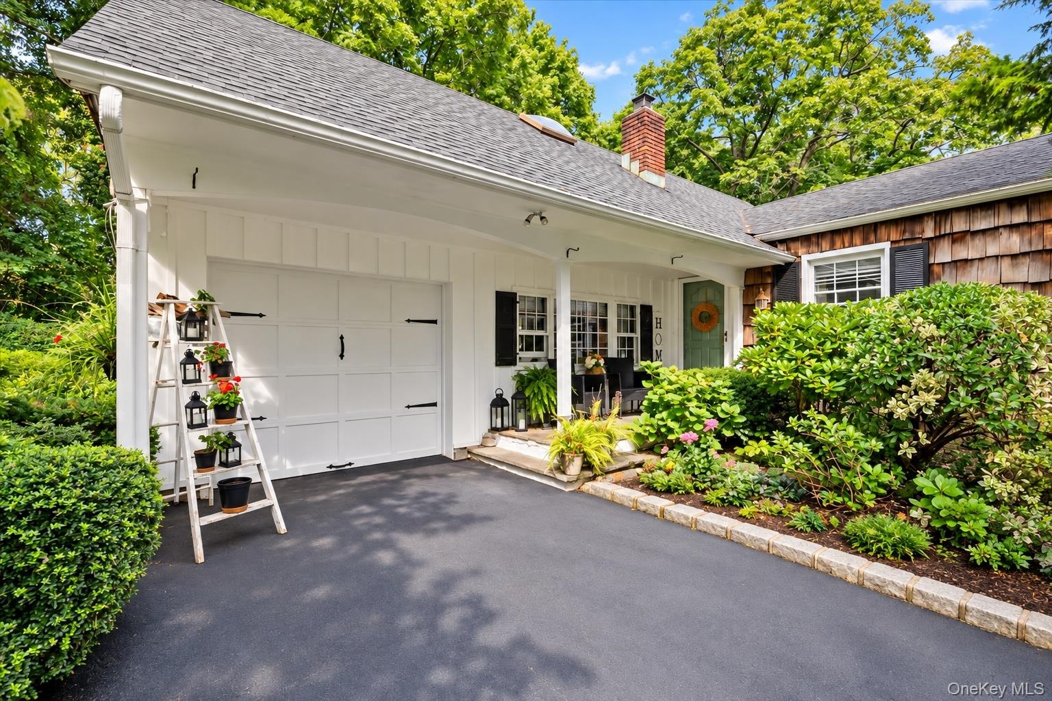 White board-and-batten siding with a single-car garage door