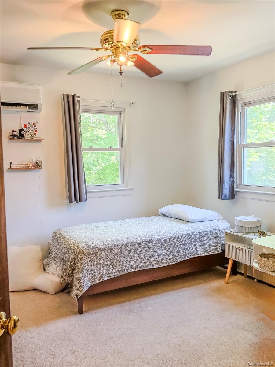 Upper Apartment  Bedroom with two windows