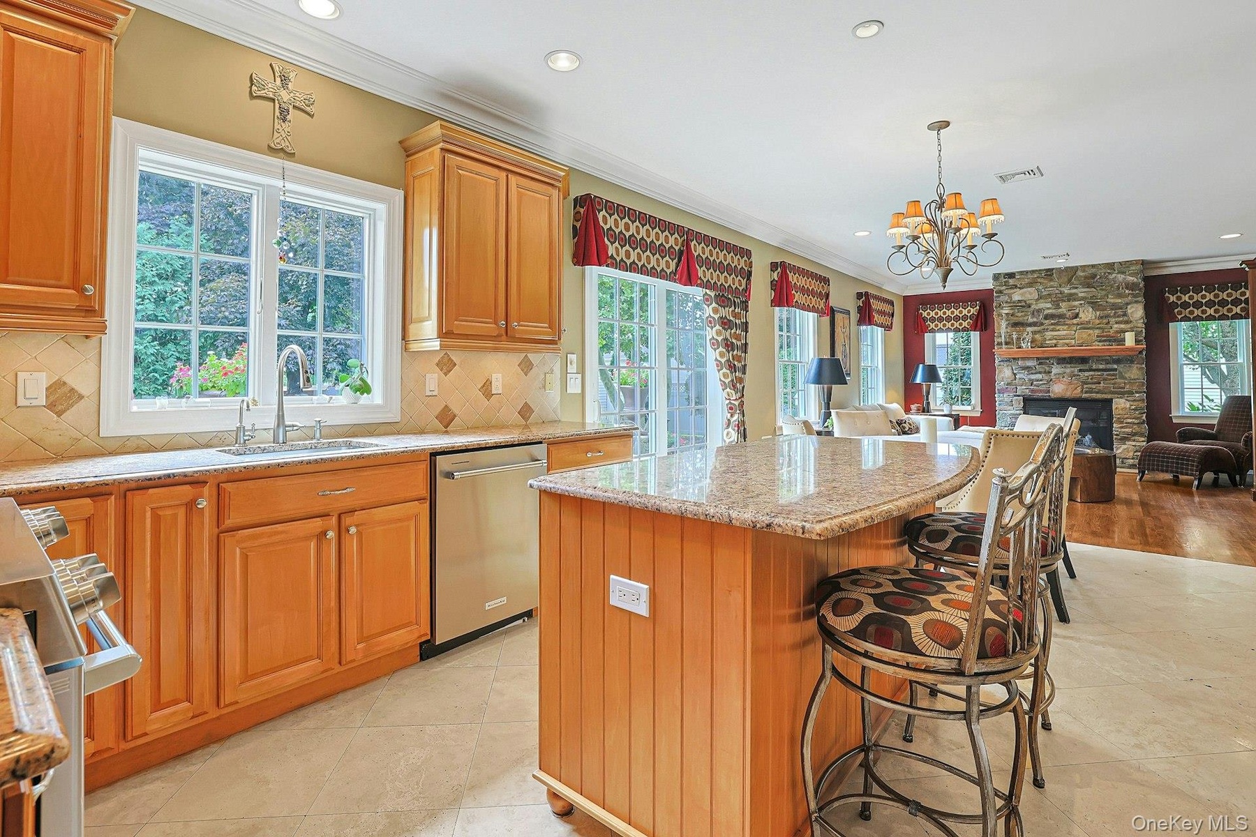 Porcelanonsa, Imported Travertine Crema-Marfil Natural Stone Throughout Kitchen
