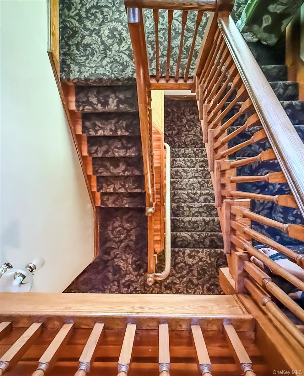 Wood staircases with ornate balusters