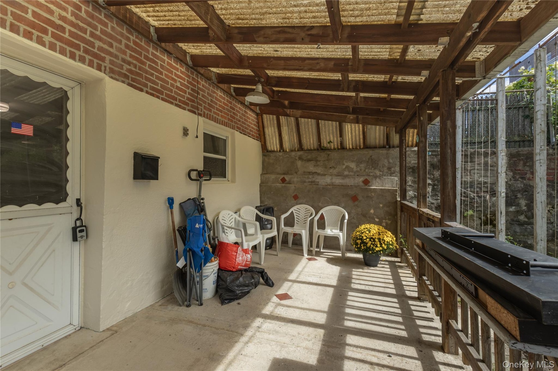 Back Patio Area w/ entrance into basement.