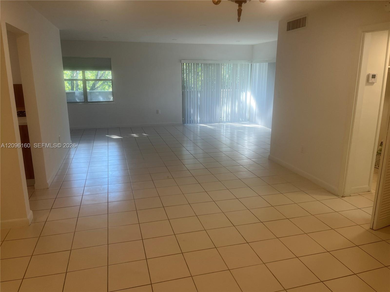 Huge Living Room with Slider to Wrap-Around Balcony