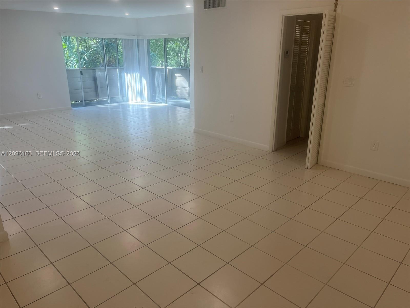 Huge Living Room with Slider to Wrap-Around Balcony