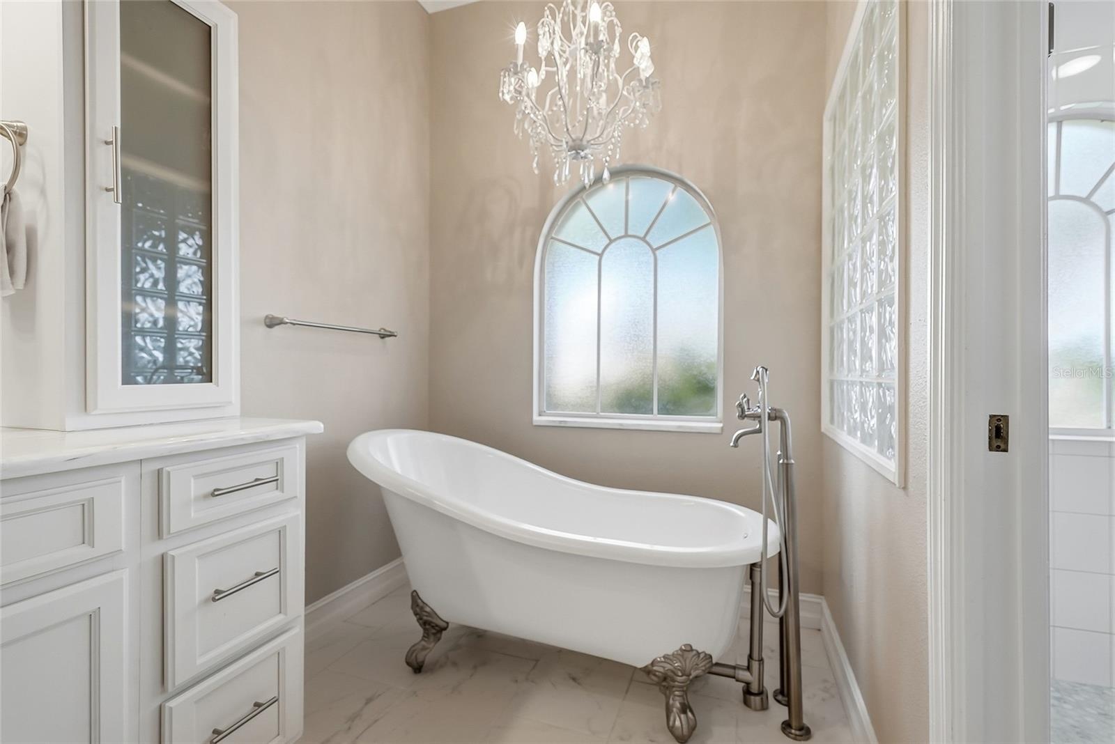 Soak the stress away in this private footed tub.