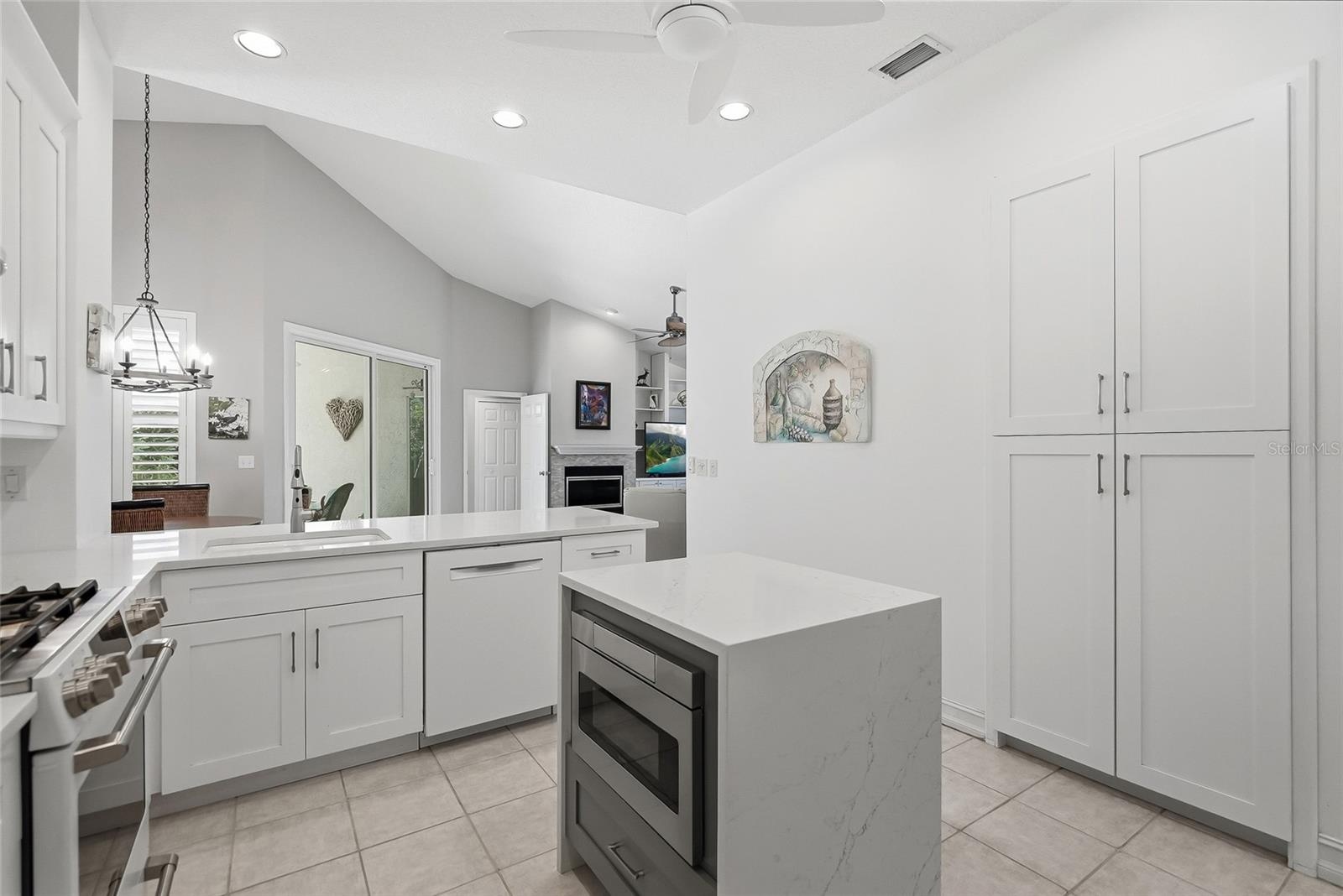 Breakfast bar with the dinette beyond creates a perfect space to congregate.