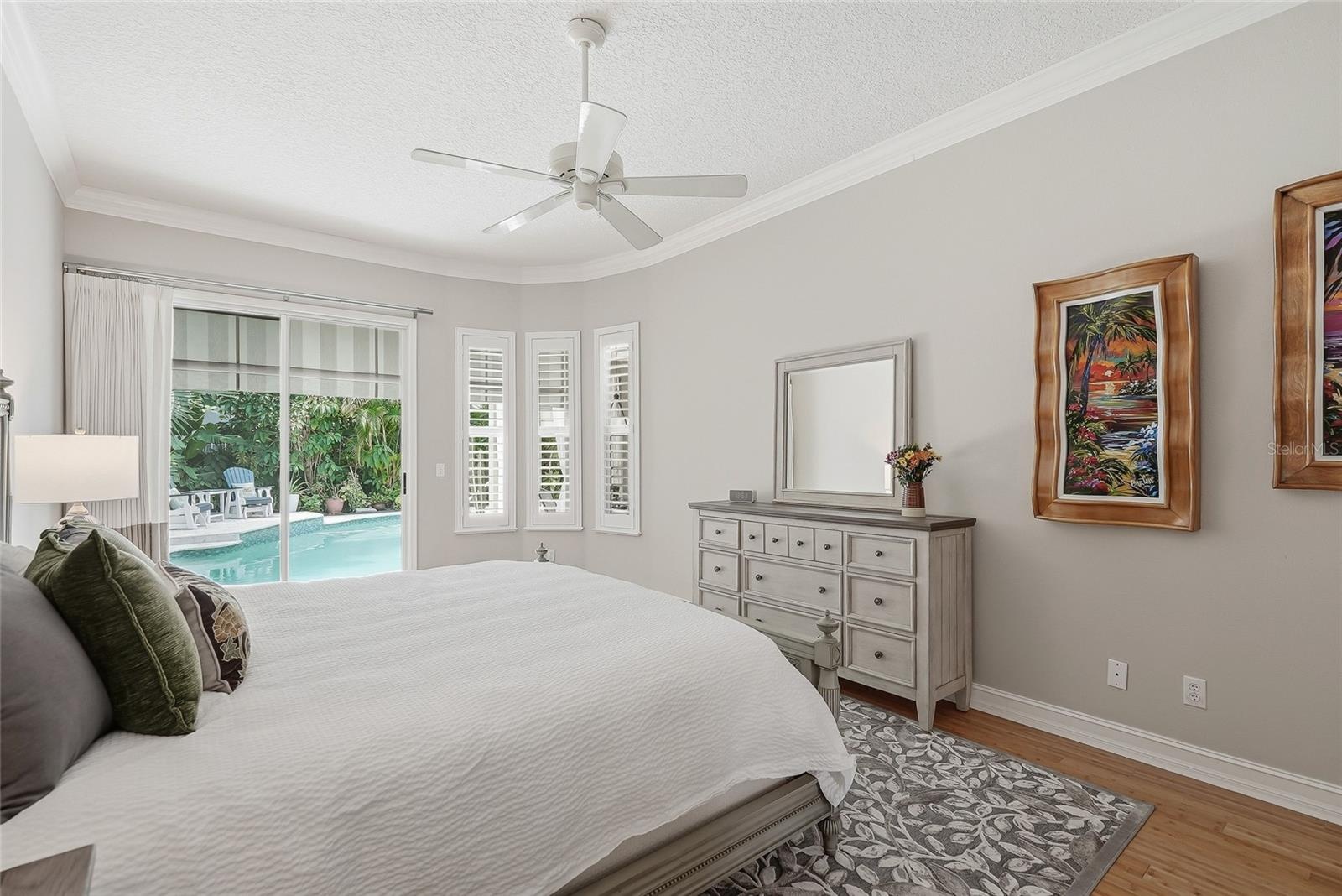 Primary bedroom has high ceilings accentuating the space.