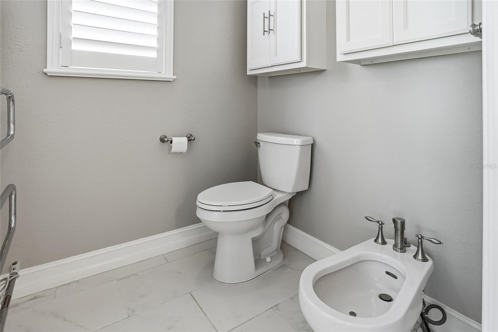 Separate commode, bidet and towel warmer for your shower experience.