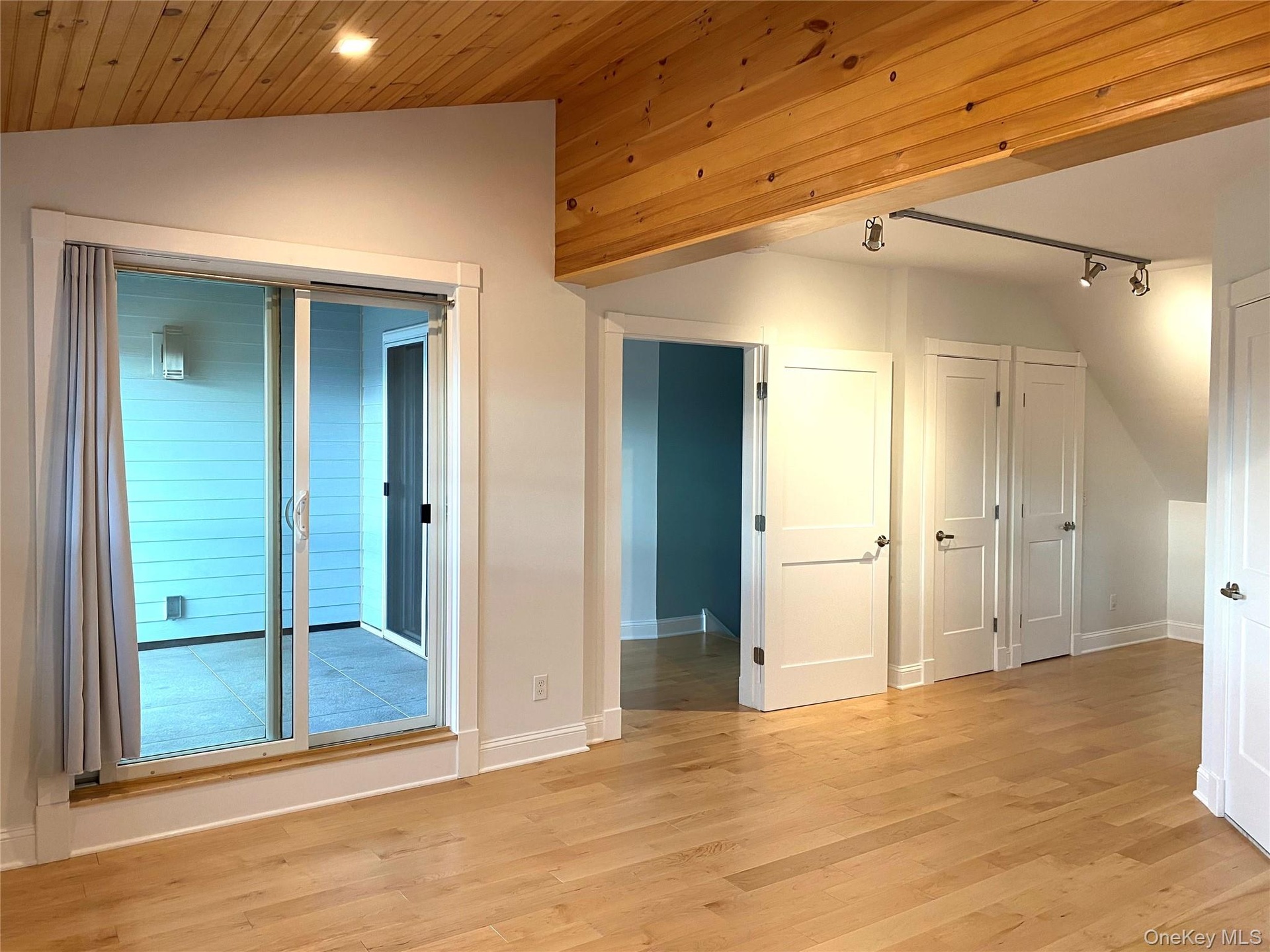 Large bedroom suite with closets and a cozy reading nook that overlooks the Armory.